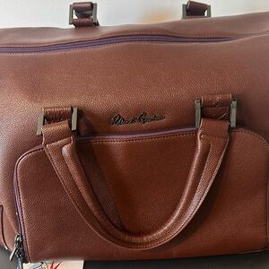 Robert Graham duffle bag.